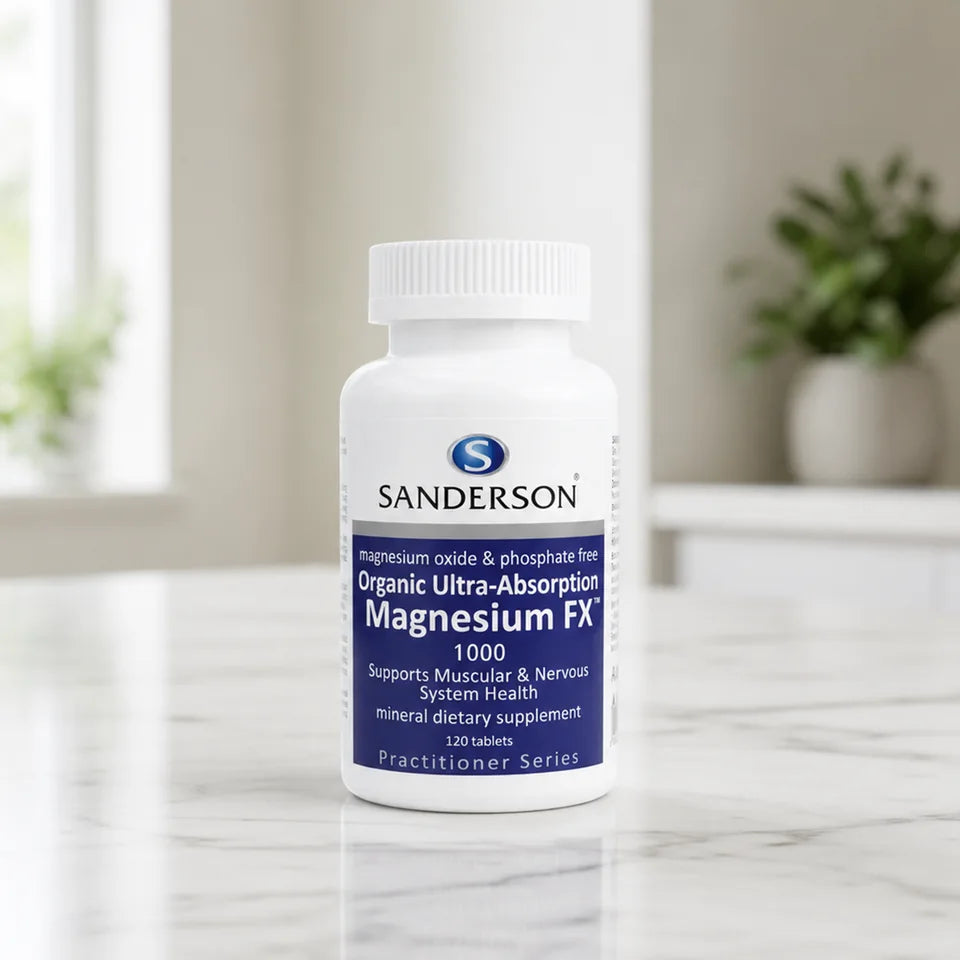 Sanderson Magnesium FX bottle on a white marble counter with plants
