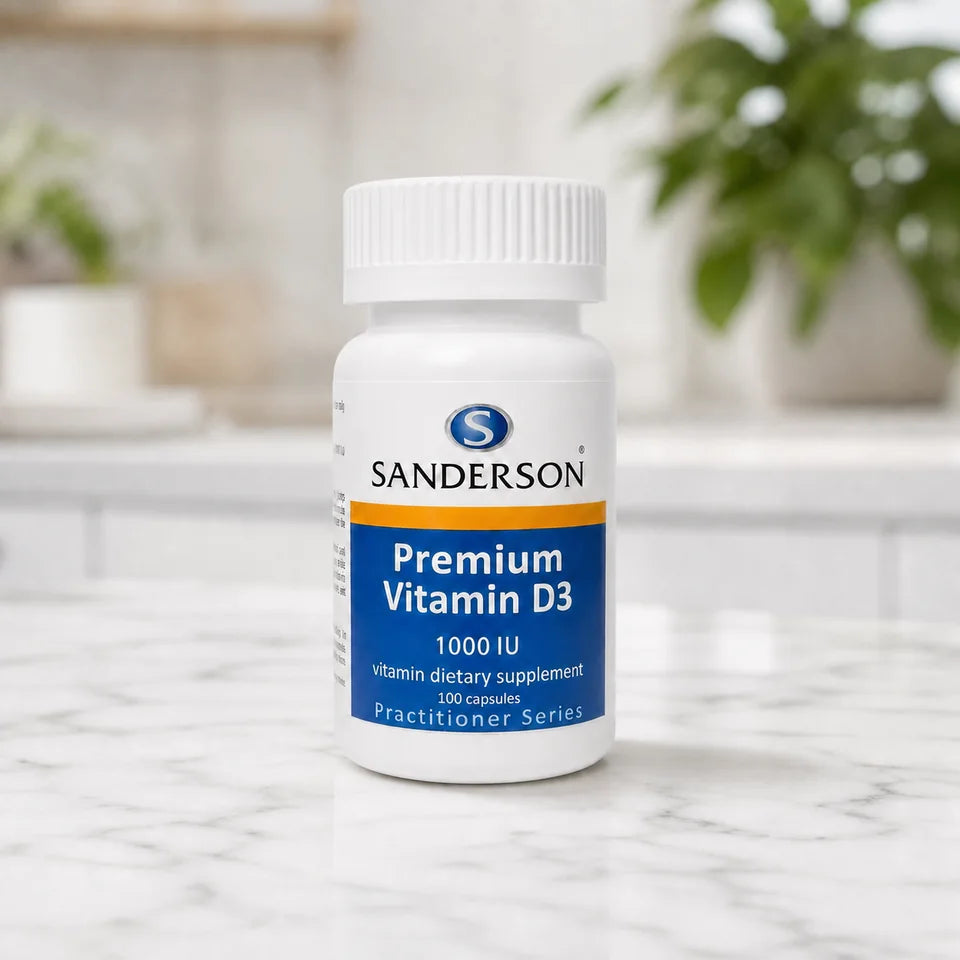 Sanderson Premium Vitamin D3 bottle on a white marble counter with plants
